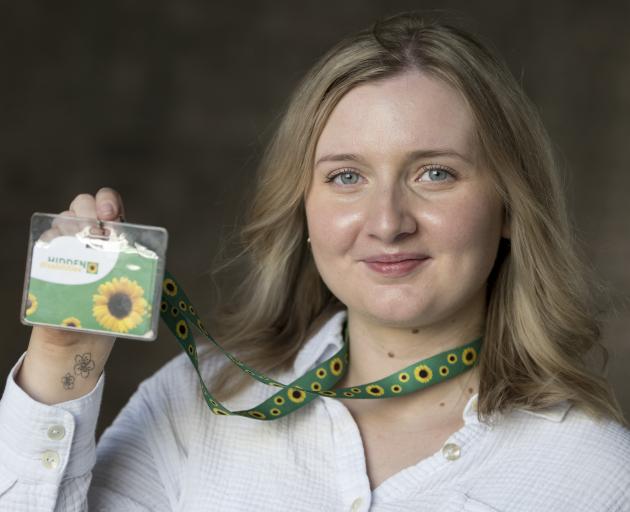 Hidden disabilities awareness advocate Hannah Pearson holds up her sunflower lanyard. PHOTO:...