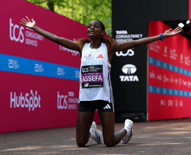 Ethiopian runner Tigst Assefa celebrates after winning the women’s elite race at the London...