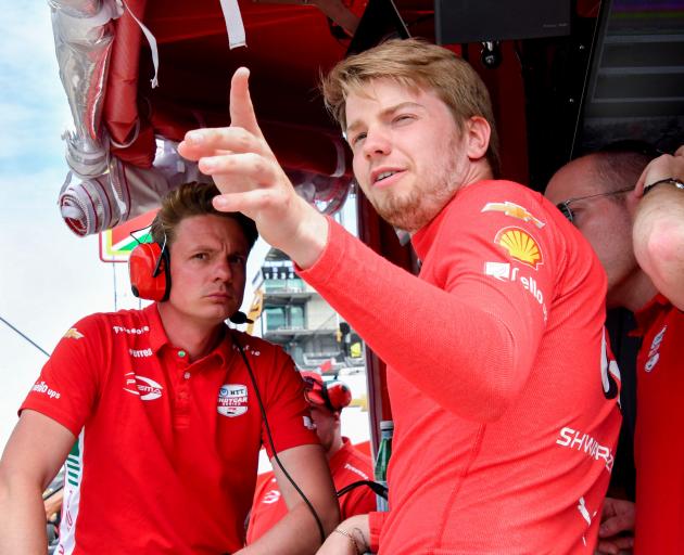 Prema Racing driver Robert Shwartzman looks out from his pit box during a practice for the 109th...