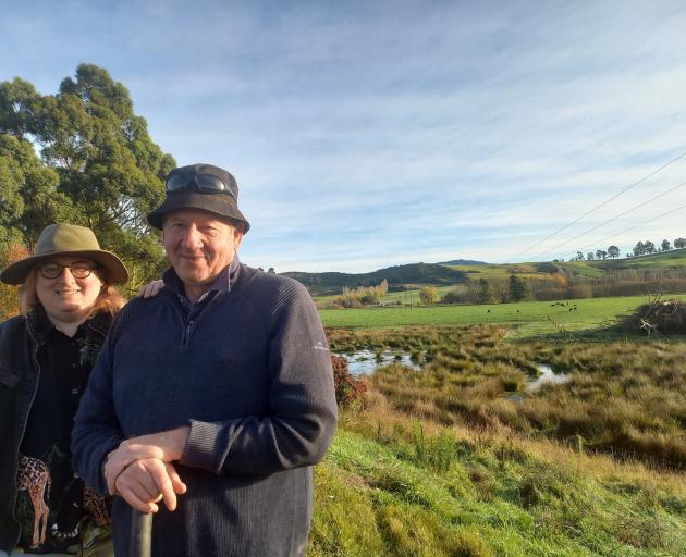 Waikākahi farmer Martin Cochrane, with daughter Jess, alongside a wetland on their farm. PHOTO:...