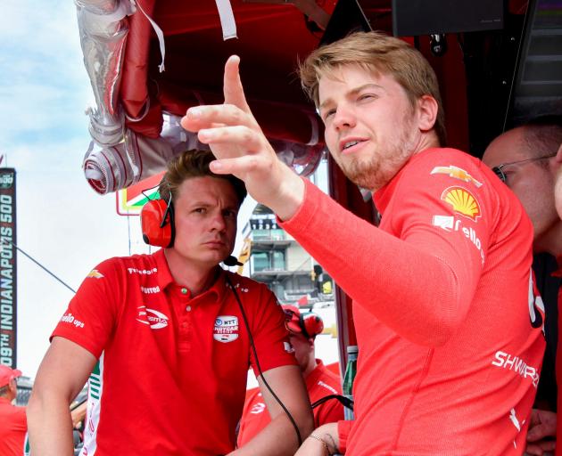 Prema Racing driver Robert Shwartzman looks out from his pit box during a practice for the 109th...