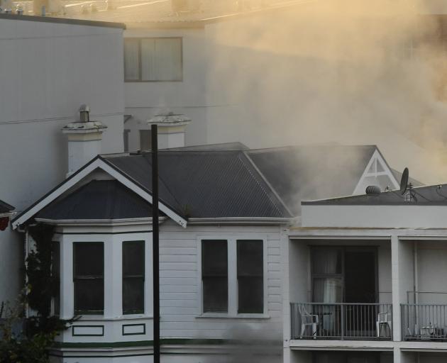 Smoke billows from the Brazen Eating House fire in Filleul St yesterday. PHOTO: STEPHEN JAQUIERY
