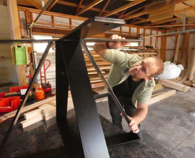 Innate Furniture co-founder Guido Loeffler works on a new design for the frame of outdoor tables....