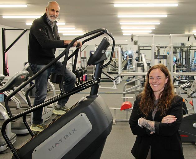 Milton Rec Centre treasurer Bruce Vollweiler climbs the new Stairmaster provided by gym manager...