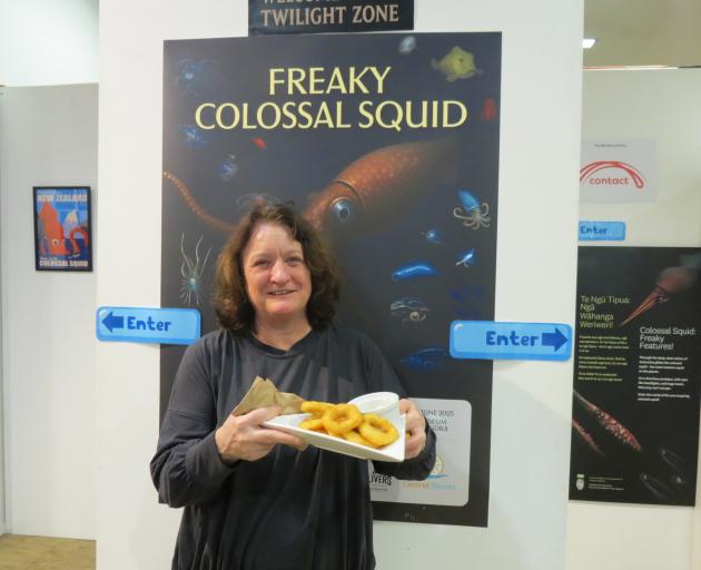 Central Stories manager Paula Stephenson offers a plate of squid rings which were popular with...