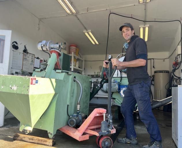 Lowburn olive man Stephen Morris readies his OMT Pegasus 500 to receive olives from Monday.