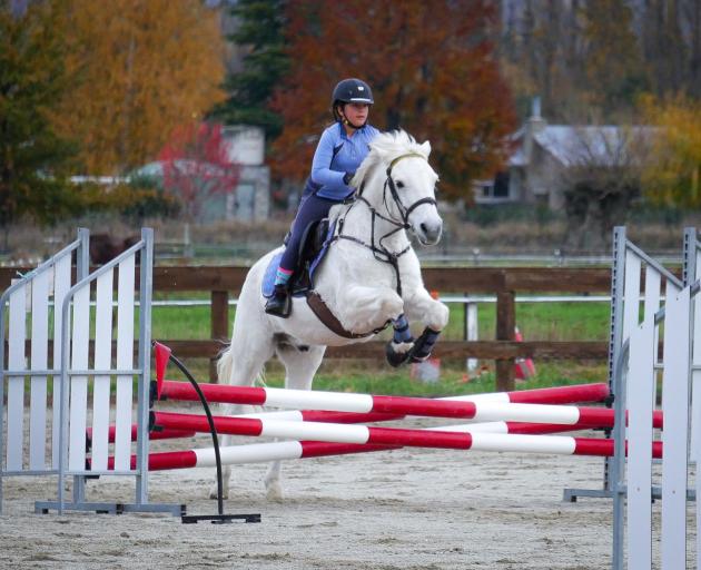 Korah Smith jumps Ash at the Riding for the Disabled fundraising have-a-go day in Alexandra last...