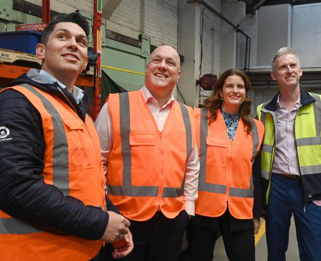Taking a tour of harbourside engineering firm Farra Engineering yesterday are (from left)...