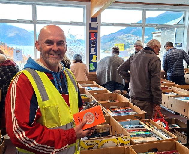 St Joseph’s School principal Alan Grant looks through the titles at the school’s annual book fair...