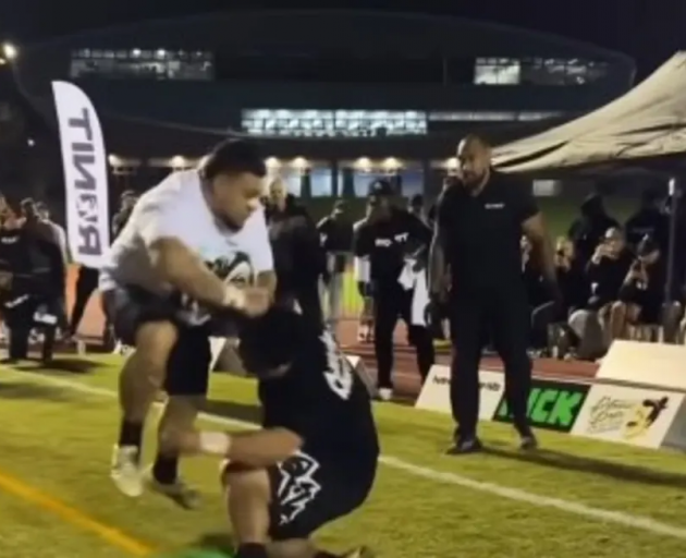 Two men collide during a 'Run it' sporting event in Auckland. Photo: Supplied / RUNIT...