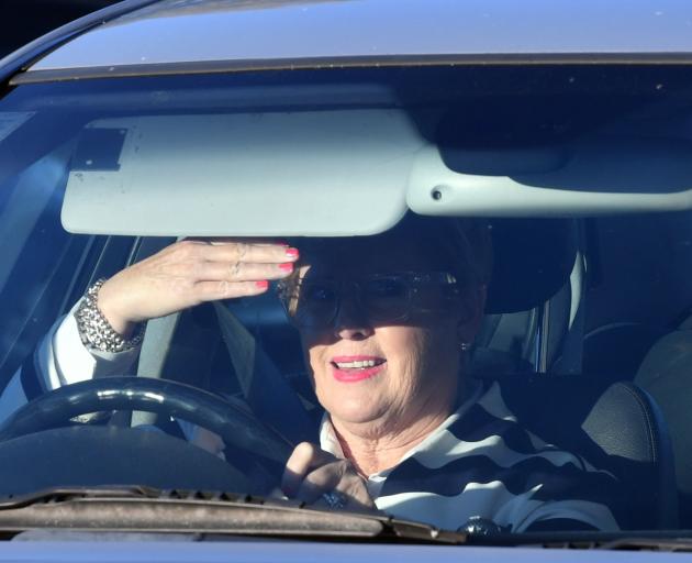 A driver blocks the sun in Mailer St yesterday. PHOTO: STEPHEN JAQUIERY