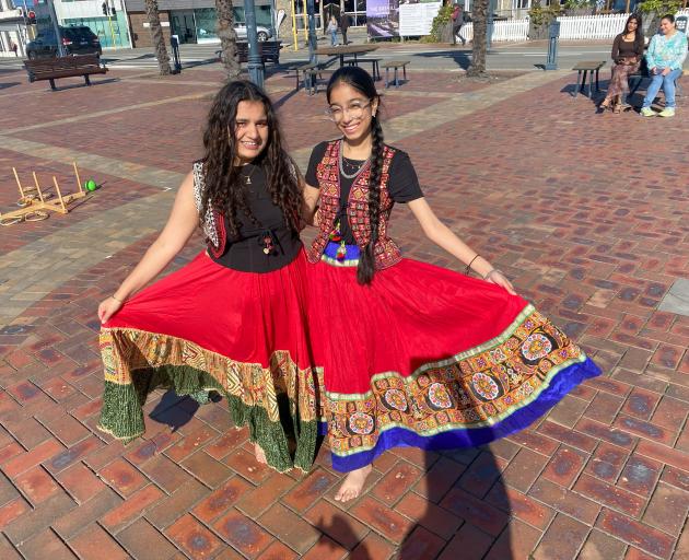 Bringing a splash of colour to the piazza these school holidays are (from left) Krishna Shah, 17,...