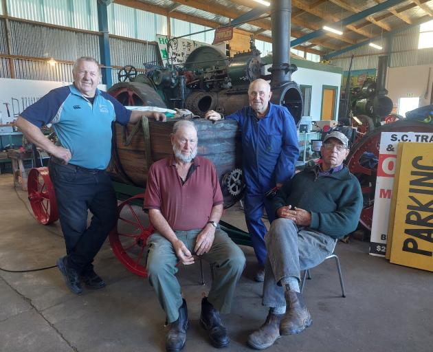 Working on a 1912 sprayer are South Canterbury Traction Engine Club members (from left) Jim...