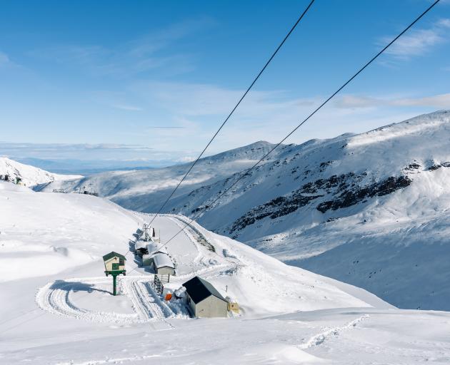 A view down the Fairlie Ridge T-bar to the carpark and towards Lake Tekapo.