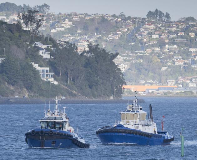 Port Otago tug Arihi tows fellow tug Otago from Dunedin to Port Chalmers yesterday, in...