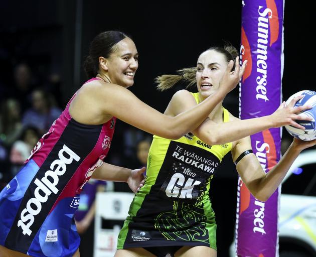 Steel goal shoot Aliyah Dunn (left) and Pulse goal keep Kelly Jackson compete for the ball during...