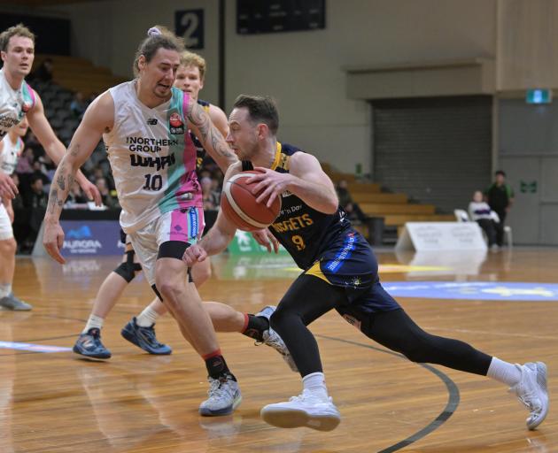 Nuggets player Darcy Knox darts low past Whai defender Denhym Brooke during their game at the...
