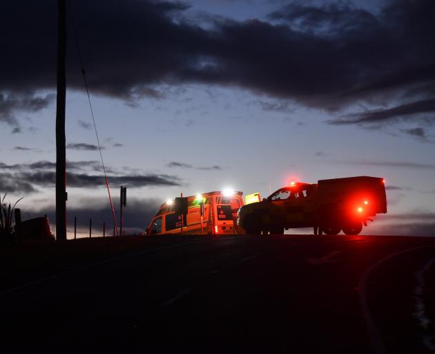 Emergency services attend the car fire near Karitane this morning. Photo: Stephen Jaquiery