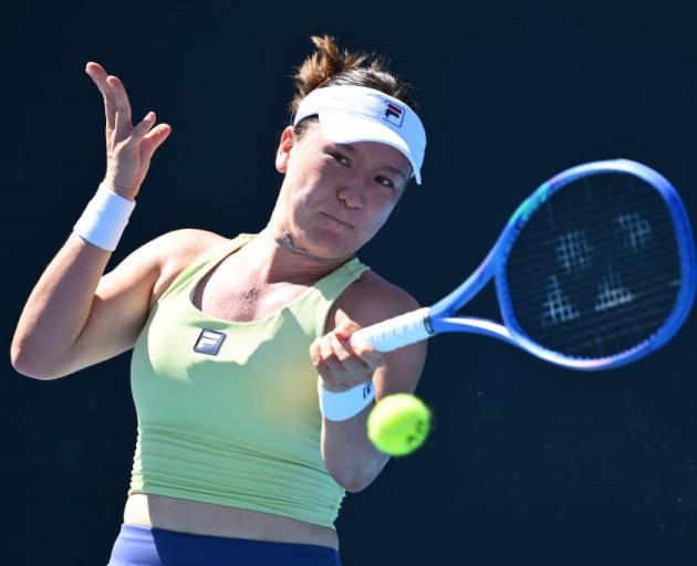 Lulu Sun plays a backhand against Danka Kovinic during their first round match in Melbourne...