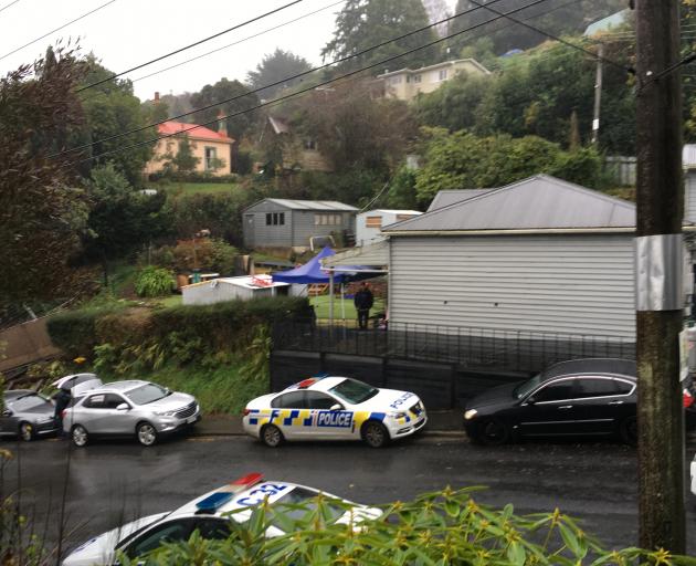 Police in Gladstone Road this morning. Photo: Gerard O'Brien