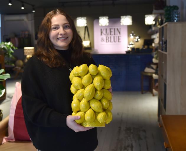 Klein & Blue manager Jemma Powell shows off a lemon-shaped porcelain vase at the Moray Pl...