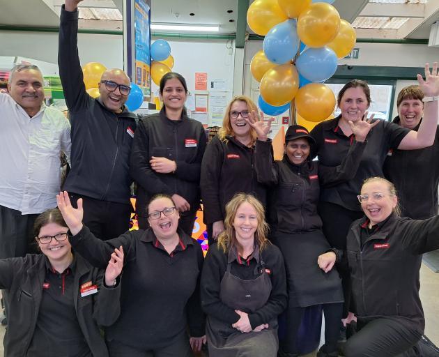 Plaza SuperValue Invercargill owners Jigs and Shelly Buha (back row, second and third from left)...