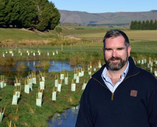 DairyNZ senior environment specialist Justin Kitto at the wetland on the farm of Ian and Sandra...