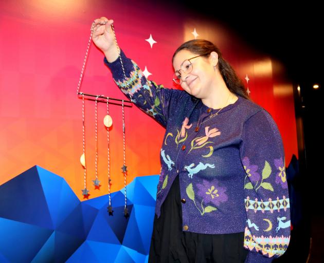 Events manager Rachel MacJeff holds a baby constellation mobile, one of many items people can...
