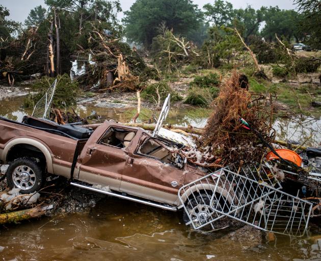 A pickup truck sits damaged after deadly flooding in Kerrville, Texas. Photo: Reuters