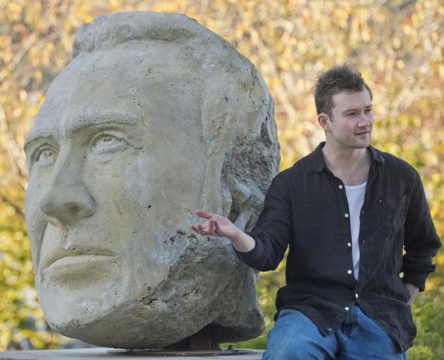 Zac Whiteside sits beside Behold OZ, an artwork created as part of The Four Plinths Project in...