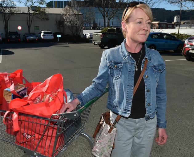 Caroline Spooner, of Dunedin, with her latest trolley of groceries, which cost about $400. PHOTO:...
