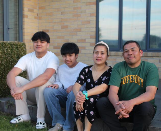 Ariane and Christine Latanafrancia and their sons Sar, 19 and Christiane, 13, who became New...