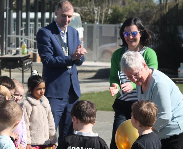 Beverley West (right), who first attended Balfour School in 1945, cut the ribbon to officially...