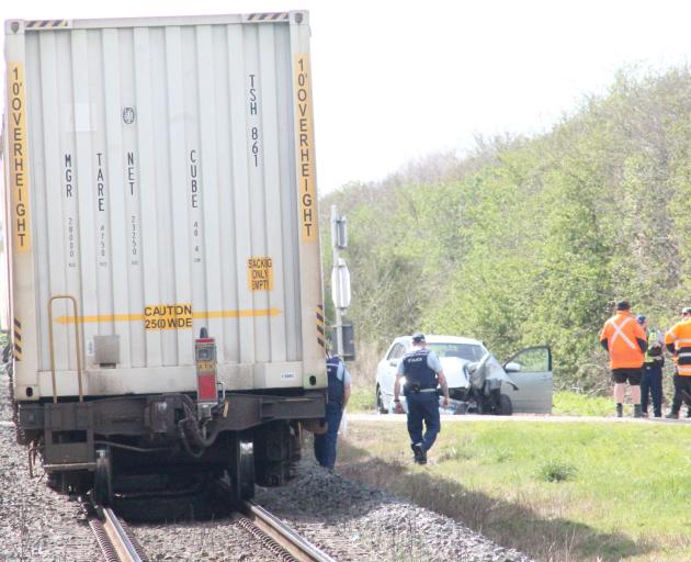 Police at the scene of the collision in Southland today. Photo: Gerrit Doppenberg