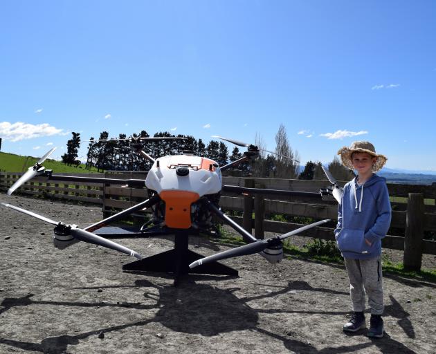 George Cooney, 7, of Pleasant Point, inspects a Agri-copter BFD 70 drone.