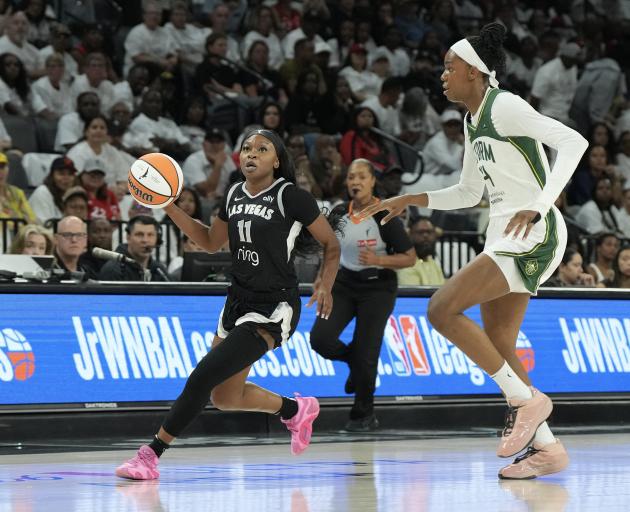 Las Vegas Aces guard Dana Evans (11) looks to shoot against Seattle Storm centre Dominique...