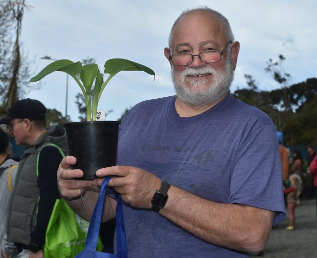 Adrian Cross snatches a bargain at the annual Dunedin Botanic Garden plant sale yesterday. PHOTO:...