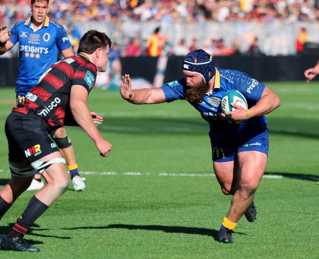 Otago hooker Liam Coltman prepares to fend Canterbury flanker Zach Gallagher. PHOTO: NZRUGBY...