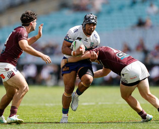 Tom Ale of the Warriors is tackled during the NRL State Championship Grand Final match between...