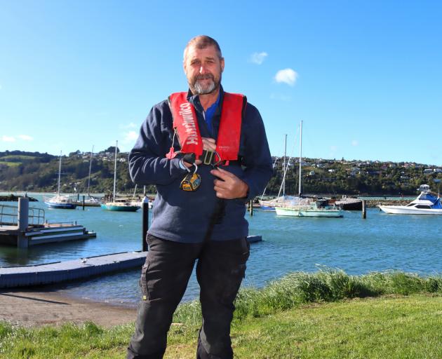 Otago Regional Council deputy harbourmaster Pete Dryden shows that allowing space for a fist is a...