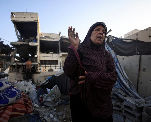 A Palestinian woman at the site of Wednesday's Israeli strike in Gaza City. Photo: Reuters 
