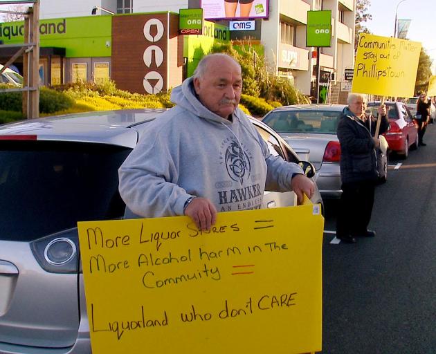 Hawker protesting against the opening of a new Liquorland store in 2018. PHOTO: GEOFF SLOAN