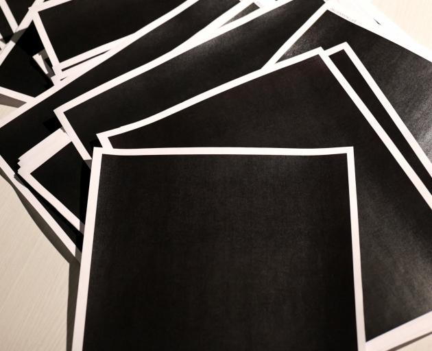 The newly released documents include multiple pages that are entirely blacked out. Photo: Reuters 