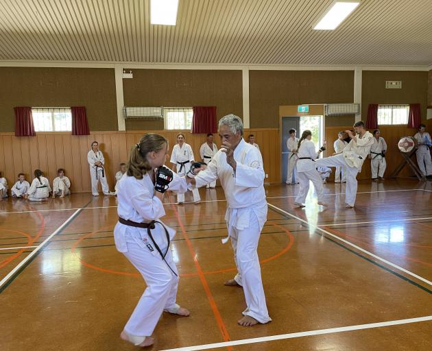 Olivia Smith fighting James Wanahi, one of 25 rounds of contact fights, a step towards earning...