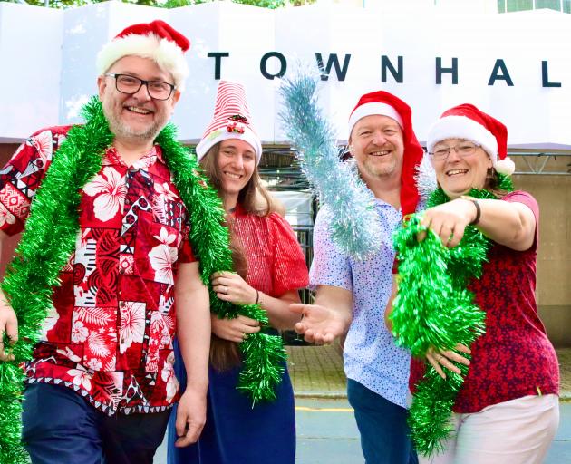Ready to welcome all to a feast of fun are members of the Dunedin Christmas Charitable Trust team...