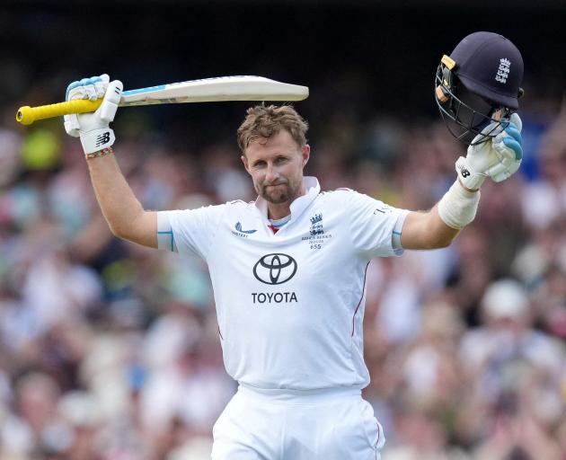 England's Joe Root celebrates after reaching his century at the SCG. Photo: Reuters
