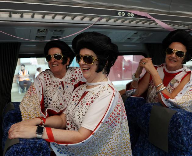 Fans stand on board the Elvis Express. Photo: Reuters