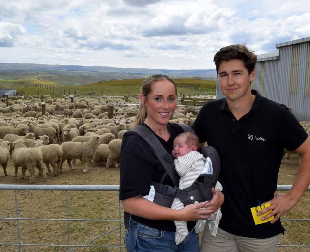 Taking their 3-week-old son Mac Meikle to his first sheep sale are parents Kate Dunlevey and Joel...