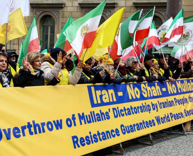 People rally against the Iranian government under the motto "No to the Shah, No to the Mullahs",...