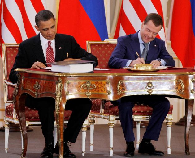 Barack Obama and Dmitry Medvedev, who were then the US and Russian presidents, sign the new...